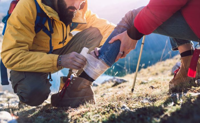 giving a first aid kit to travel partner